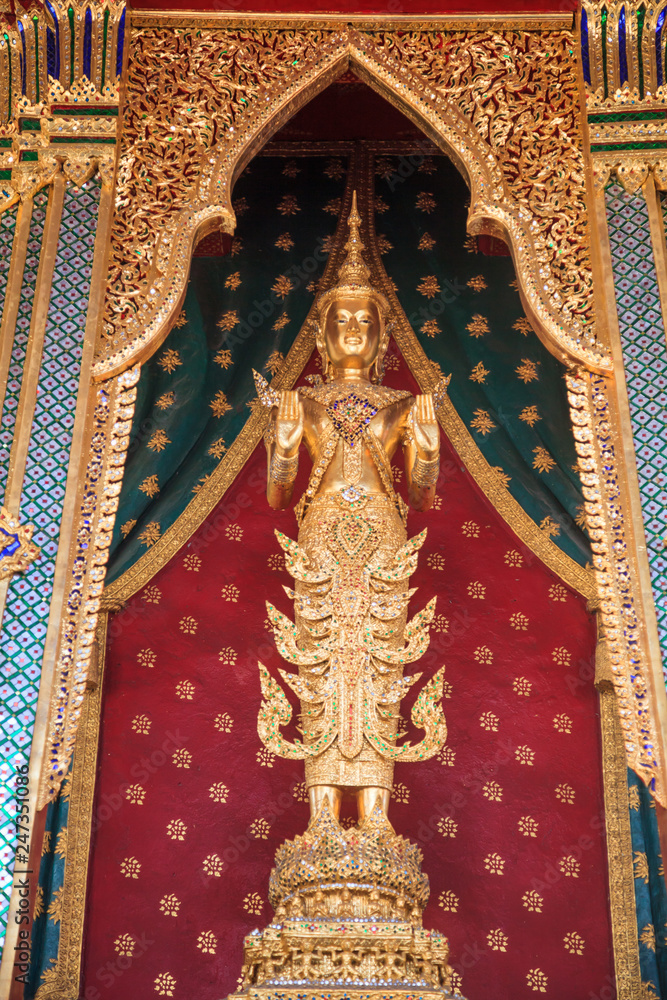 Buddhanarumitr Buddha image statue, replicating King Rama II, enshrined in Thai styled golden chariot (movable throne) in front of main pagoda chapel in Wat Arun (The Temple of Dawn) Bangkok, Thailand