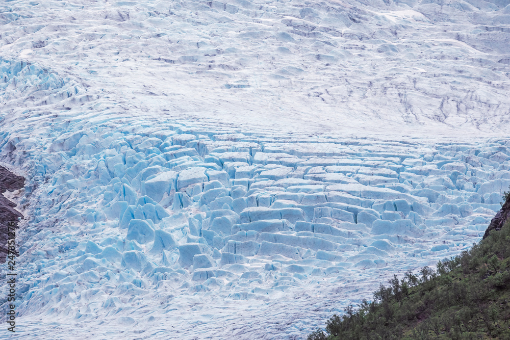 Crevasses in a glacier tongue of the Svartisen seen from the jetty at the Holandsfjord Crevasses in a glacier tongue of the Svartisen seen from the jetty at the Holandsfjord