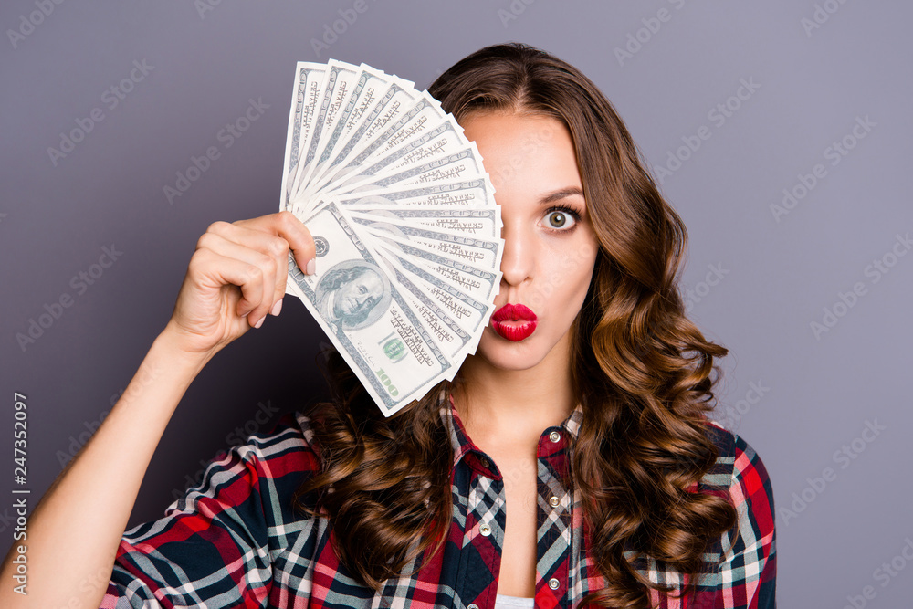 Close up portrait of beautiful curly wavy wondered she her lady hands eye hide fan of money send air kiss wealthy just invited bank wearing casual checkered shirt isolated grey background