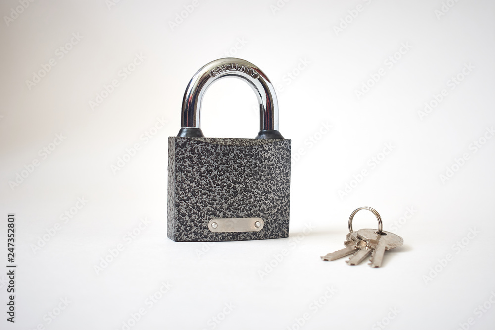 Cast iron padlock with bunch of keys isolated on white. Concept security. Cast iron padlock with bunch of keys isolated on white. Concept security.