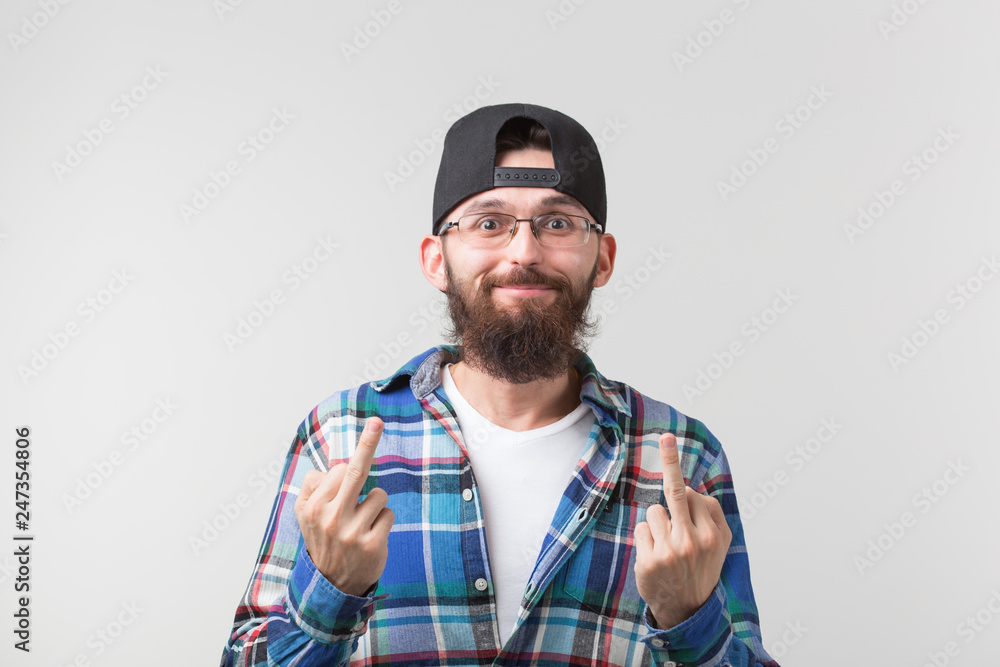 Portrait of funny man showing middle finger gesturing fuck on white background Portrait of funny man showing middle finger gesturing fuck on white background