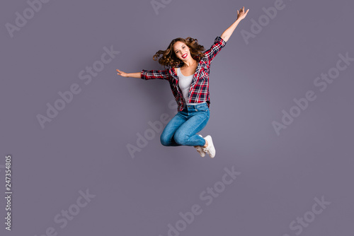 Full length body size view portrait of her she nice attractive adorable sporty lovely charming pretty cheerful cheery wavy-haired lady free time life like plane isolated over gray background