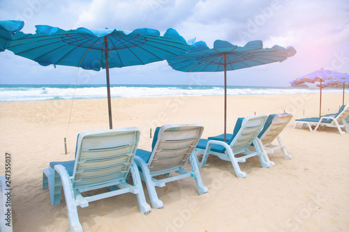 Beach summer holiday with chair and umbrella 
