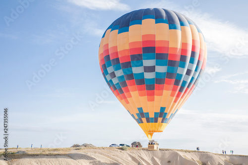 colourful hot air balloon floating over the valley in Turkey, Cappadocia  © lisinama