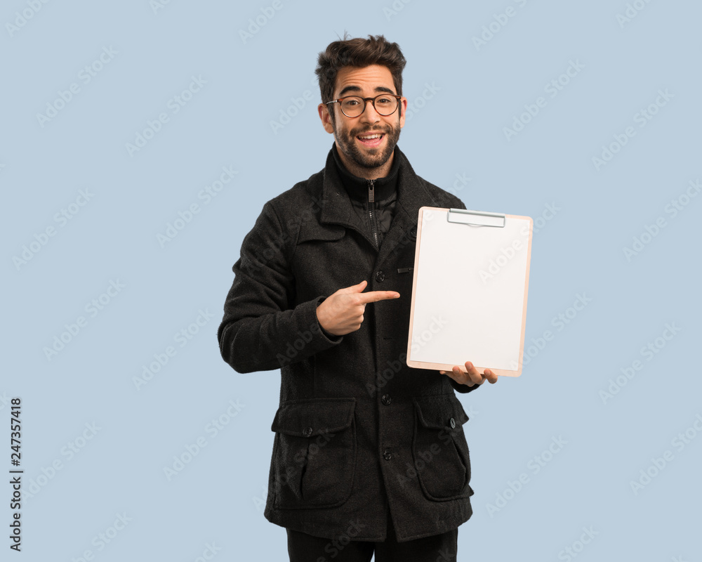 young man holding file cabinet