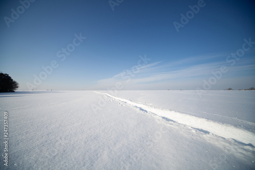  snowy field in winter. Winter landscape with  snowy fields © luchschenF