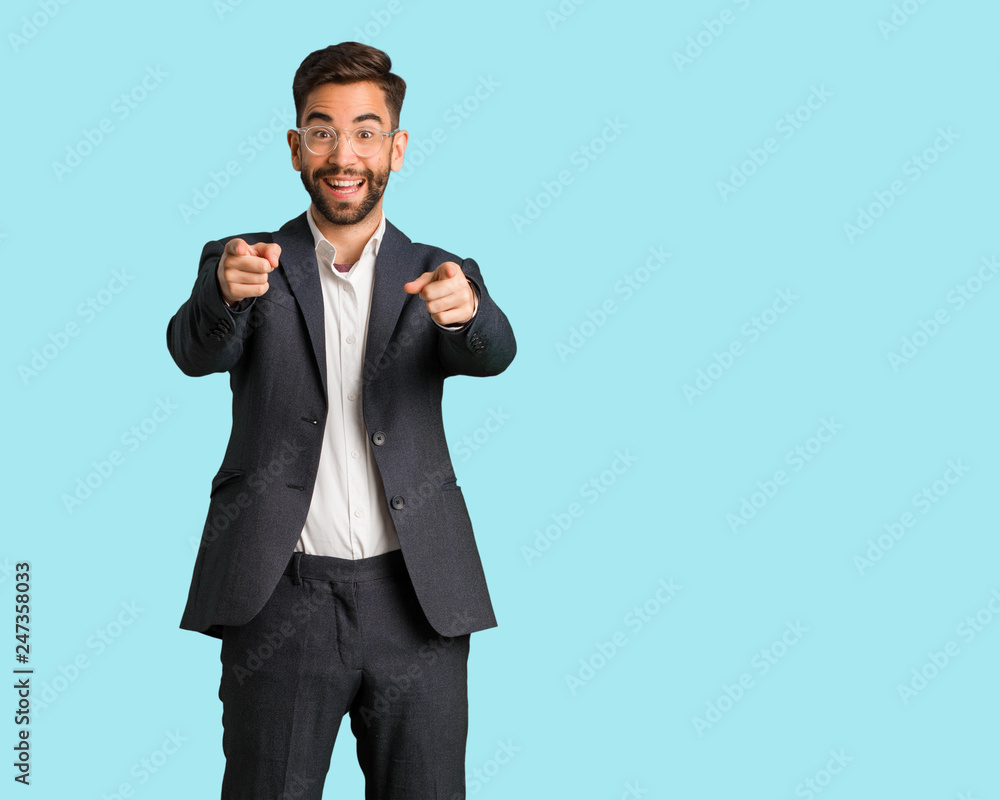 Young handsome business man cheerful and smiling Young handsome business man cheerful and smiling