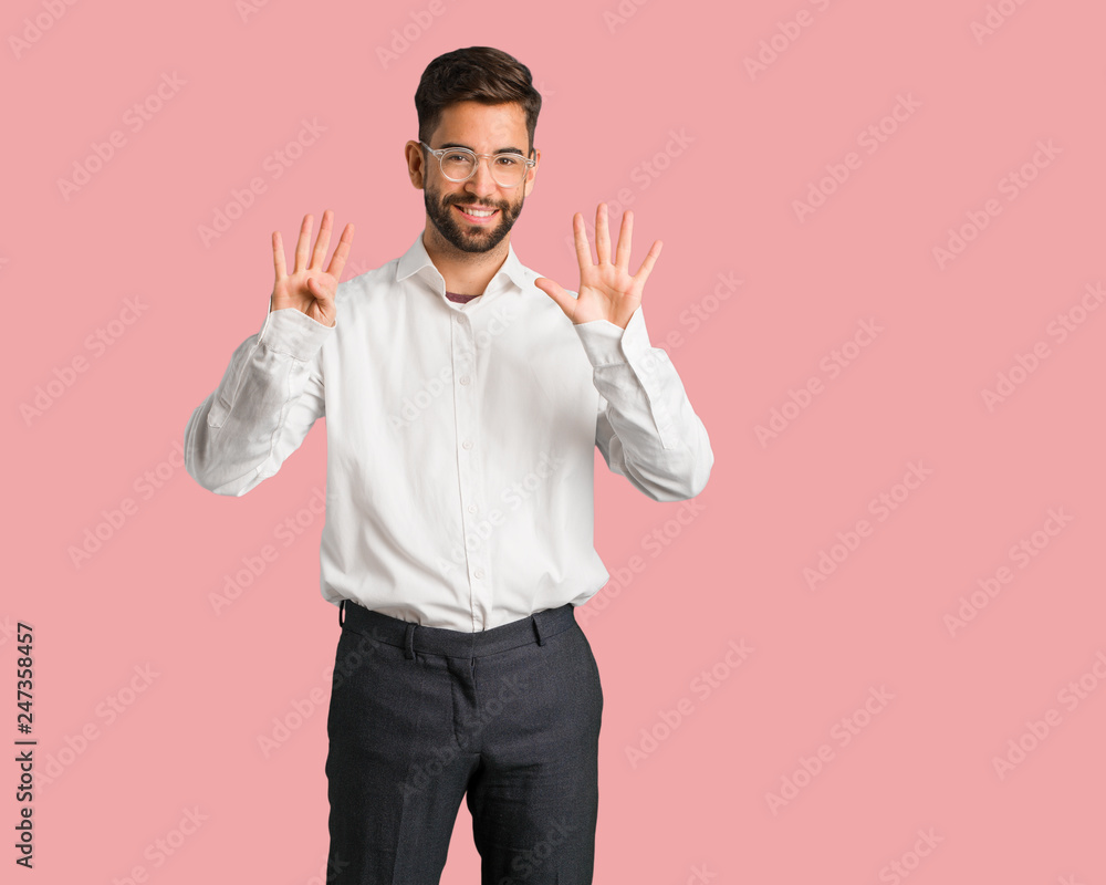 Young handsome business man showing number nine Young handsome business man showing number nine