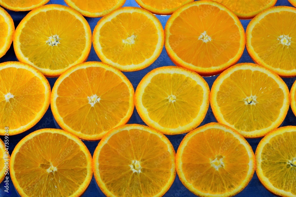 Orange background for creative design and creativity. Orange-the most common citrus culture in all tropical and subtropical regions of the world, is widely used in cooking: drinks, jams, cakes.