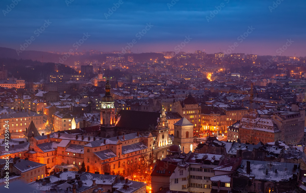 Aerial panoramic view of historical city center at night, Lviv, Ukraine. UNESCO world heritage site