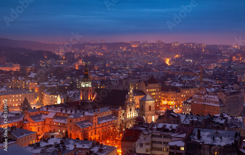 Aerial panoramic view of historical city center at night, Lviv, Ukraine. UNESCO world heritage site © haidamac