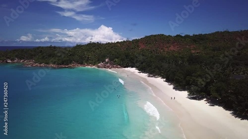 Aerial view of paradise beach, palms and blue lagoon