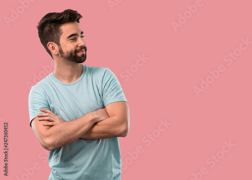 young man crossing arms