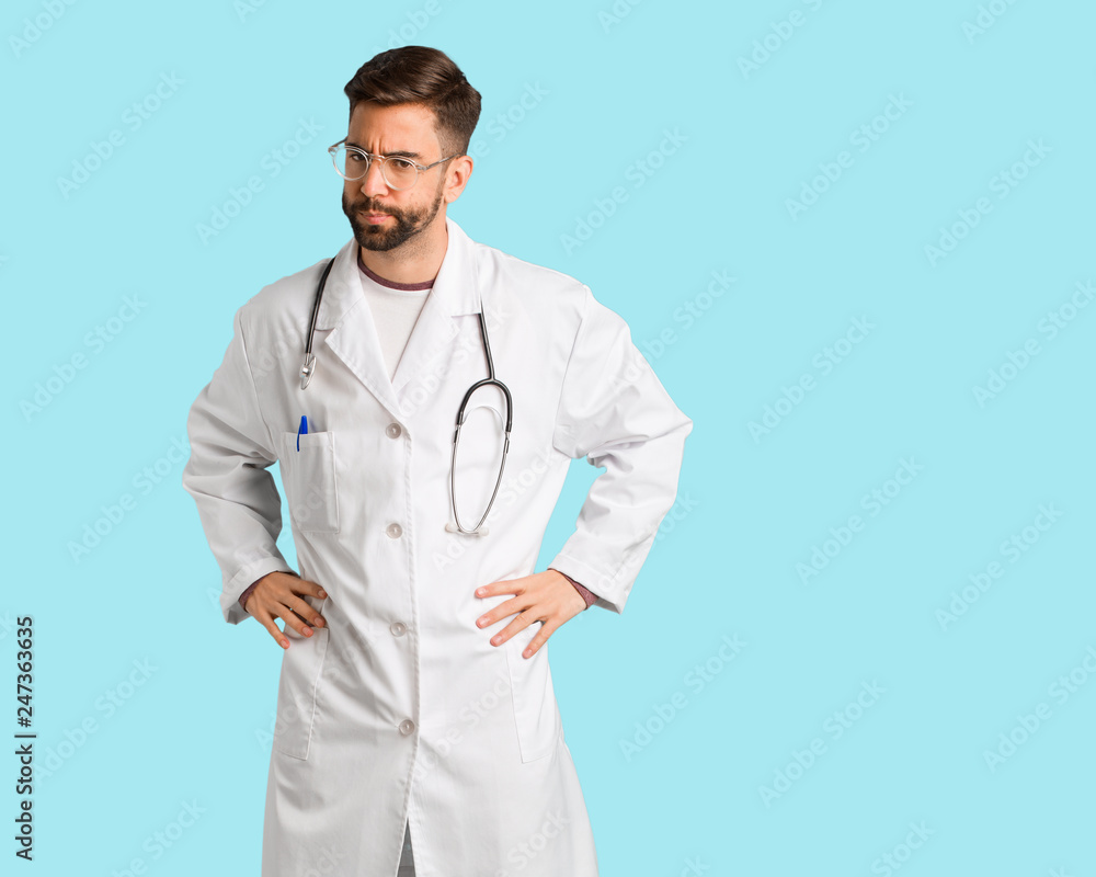 Young doctor man scolding someone very angry Young doctor man scolding someone very angry