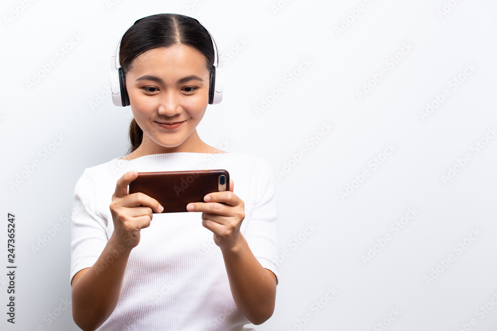 Happy woman playing to the game from smartphone Happy woman playing to the game from smartphone