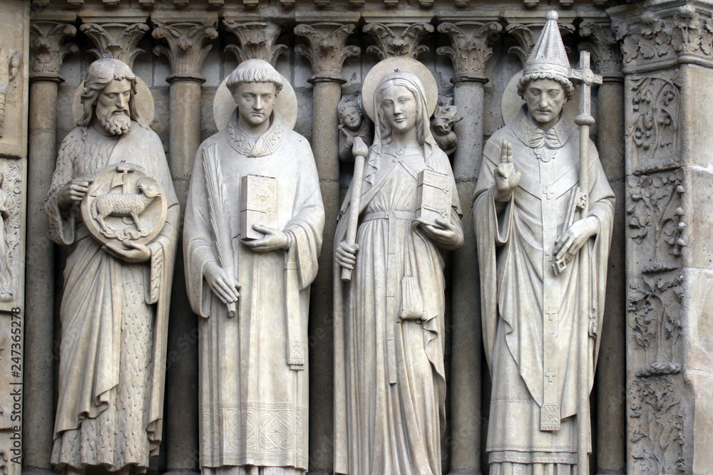 Paris, Notre-Dame cathedral, portal of the Virgin, from left to right: Saint John the Baptist, Saint Stephen, Saint Genevieve and Pope Saint Sylvester.