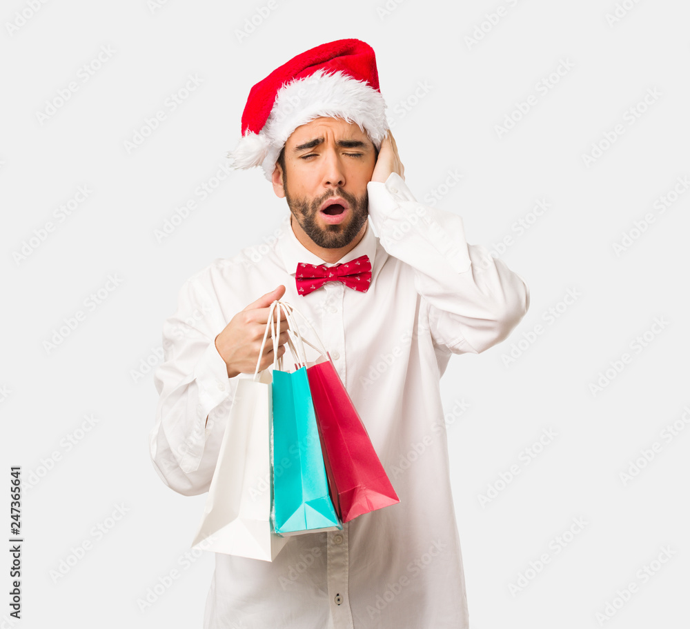 Young man wearing a santa claus hat on Christmas day