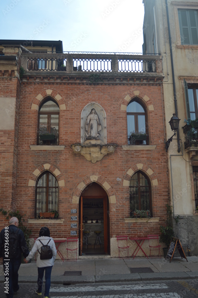 Beautiful Facade Of A Converted Building In Verona Cafe In Verona. Travel, holidays, architecture. March 30, 2015. Verona, Veneto region, Italy.