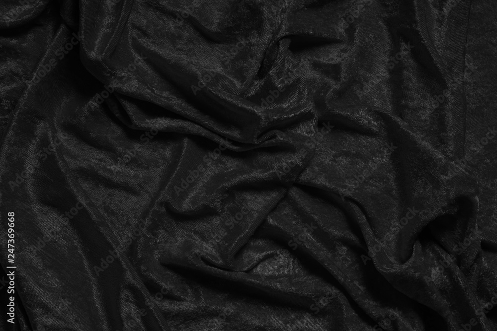 Fototapeta premium crumpled luxurious black velvet drape background texture