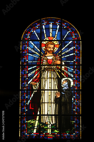 Sacred heart of Jesus and Saint Margaret Mary Alacoque, stained glass, Notre Dame de Clignancourt church, Paris, France photo
