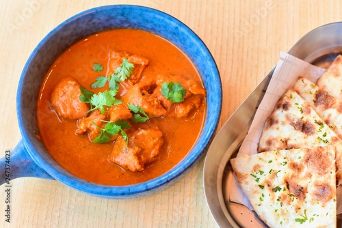 Top View of Classic Indian Butter Chicken with Naan Bread photo