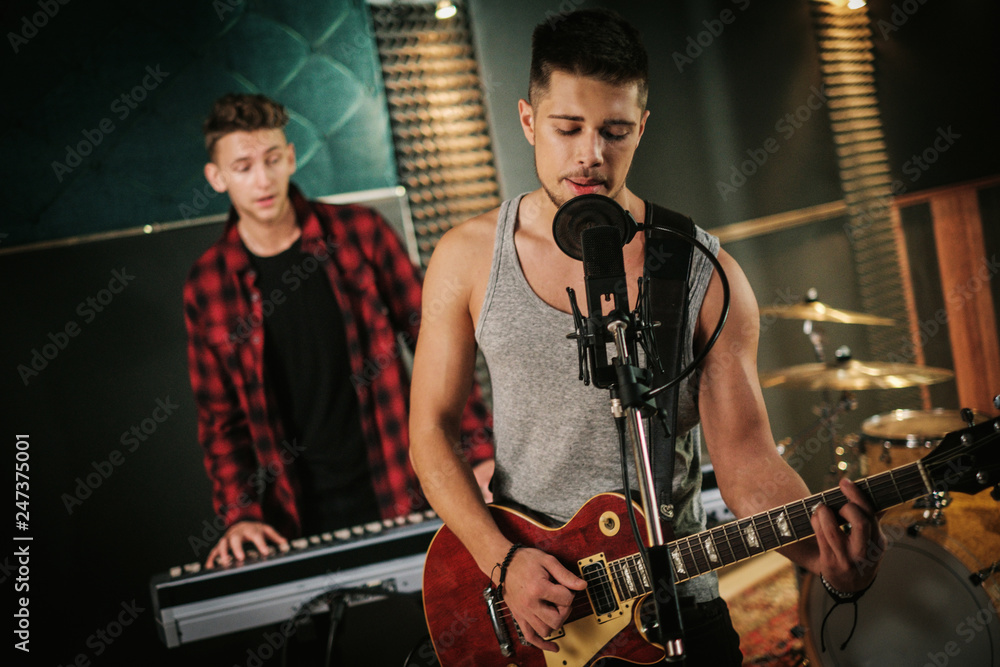Music band having rehearsal in a studio Music band having rehearsal in a studio