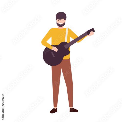 Bearded man playing guitar and singing