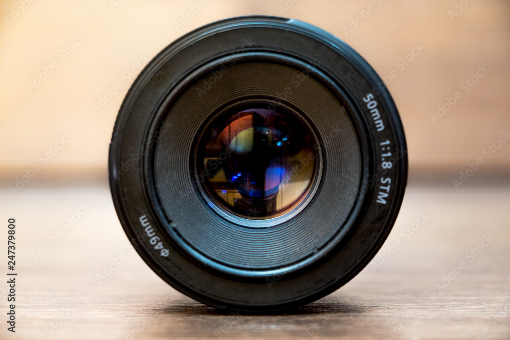 Lens for camera on blurry background. Professional photography equipment_