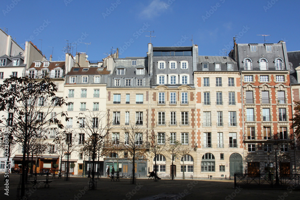 Facade of a traditional apartmemt building in Paris, France