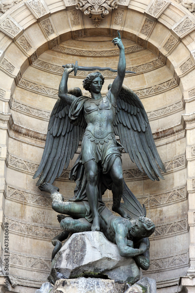 Fountain Saint-Michel at Place Saint-Michel in Paris, France. It was constructed in 1858-1860 during French Second Empire by architect Gabriel Davioud. Archangel Michael and devil by Francisque Duret.