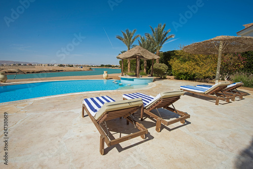 Swimming pool at at luxury tropical holiday villa resort