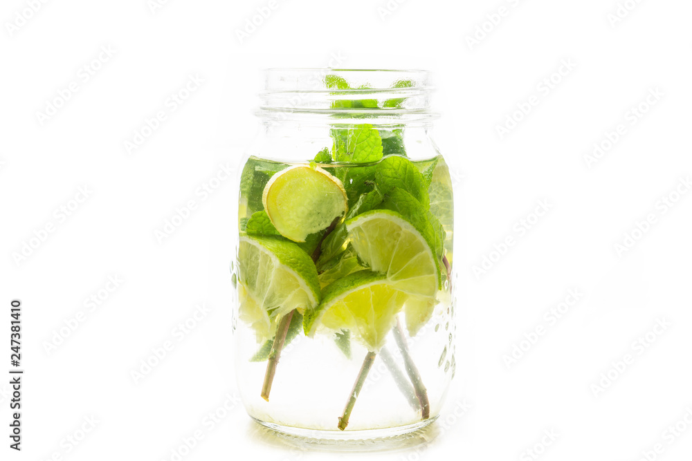 Lime, mint and ginger detox drink in jar. Selective focus. Lime, mint and ginger detox drink in jar. Selective focus.