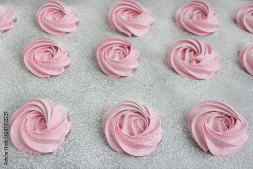 Wallpaper Mural Handmade pink zephyr on white paper background sprinkled with powder closeup Torontodigital.ca