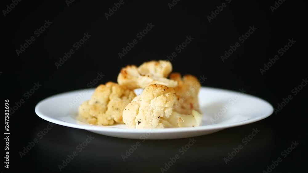 baked cauliflower with spices in ceramic form baked cauliflower with spices in ceramic form