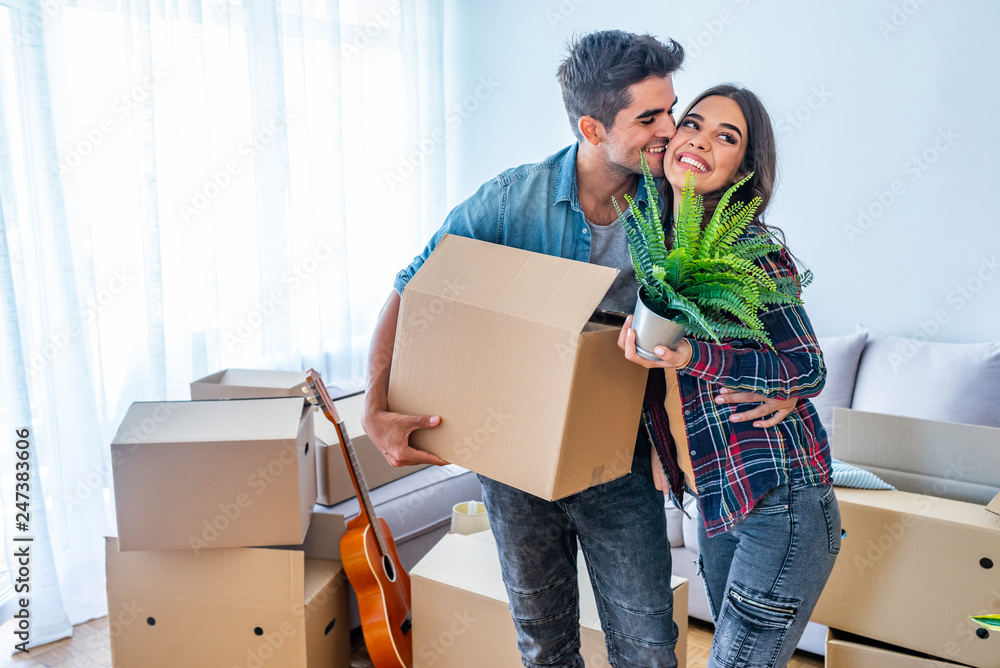 Young couple moving to a new apartment together relocation Young couple moving to a new apartment together relocation