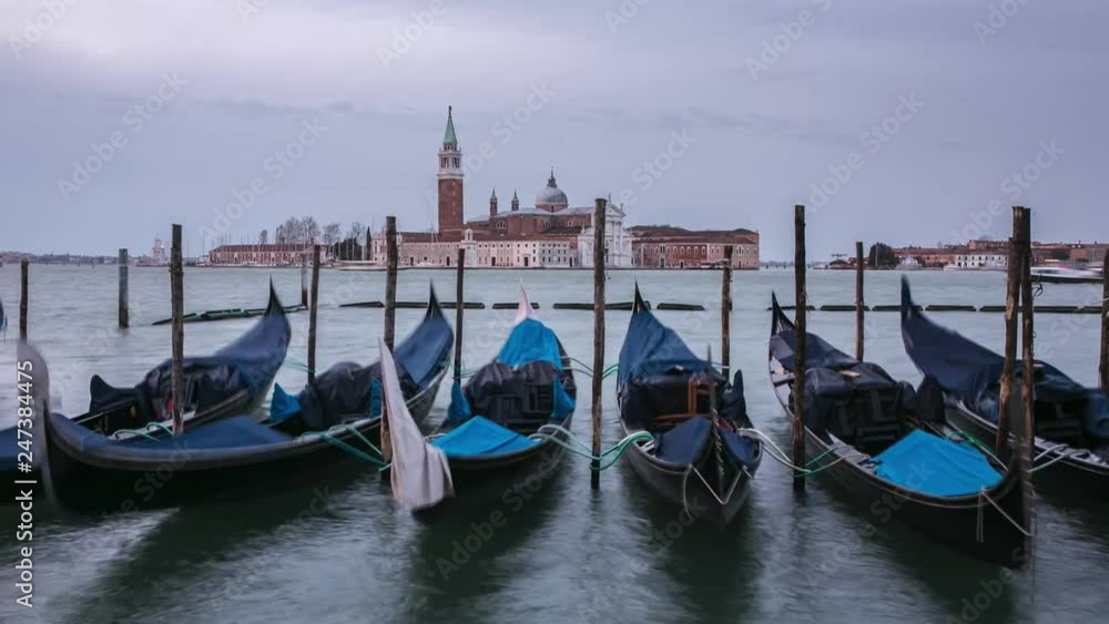 Time lapse of the San Giorgio Maggiore church and gondolas at cloudy day in Venice, Italy. Time lapse of the San Giorgio Maggiore church and gondolas at cloudy day in Venice, Italy.