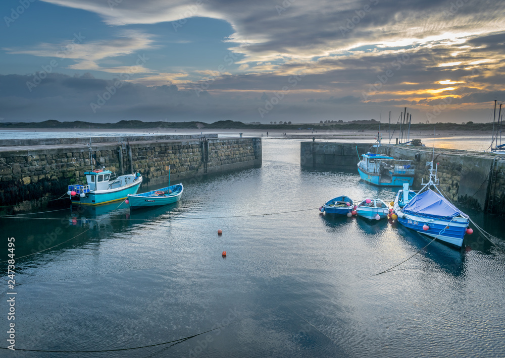 the only port or harbour facing inland in the united kingdom. fishing boats at dawn or dusk