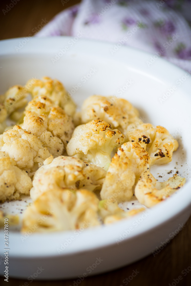 baked cauliflower with spices in ceramic form baked cauliflower with spices in ceramic form