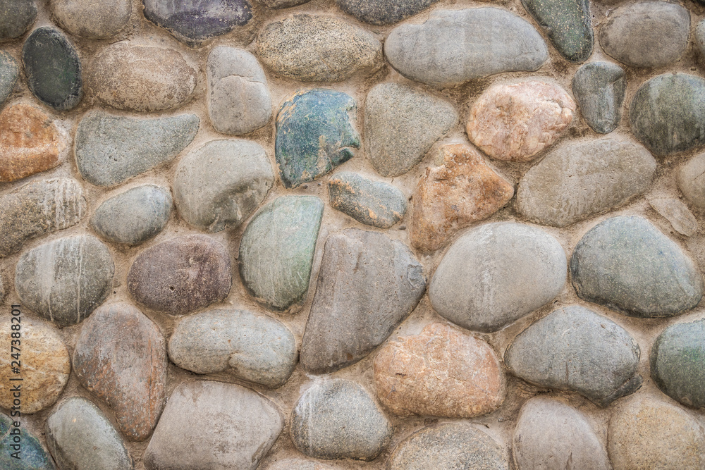 Gray pebble stone wall. pebbles. high resolution background