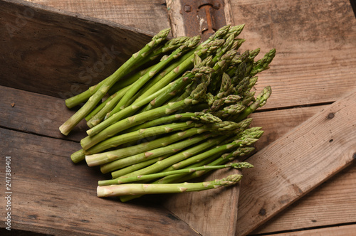 green asparagus on old board