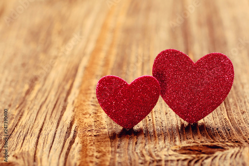 Two hearts on a wooden background on Valentines Day