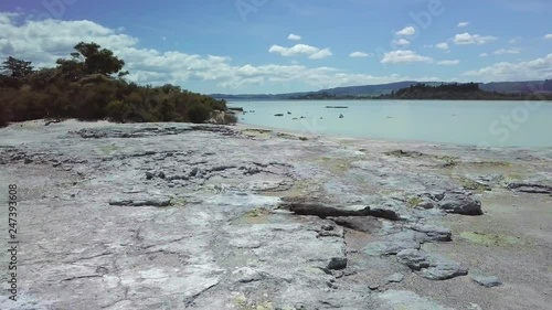 Drone shot of fumarole field with steaming vents and mudpots on island in New Zealand photo