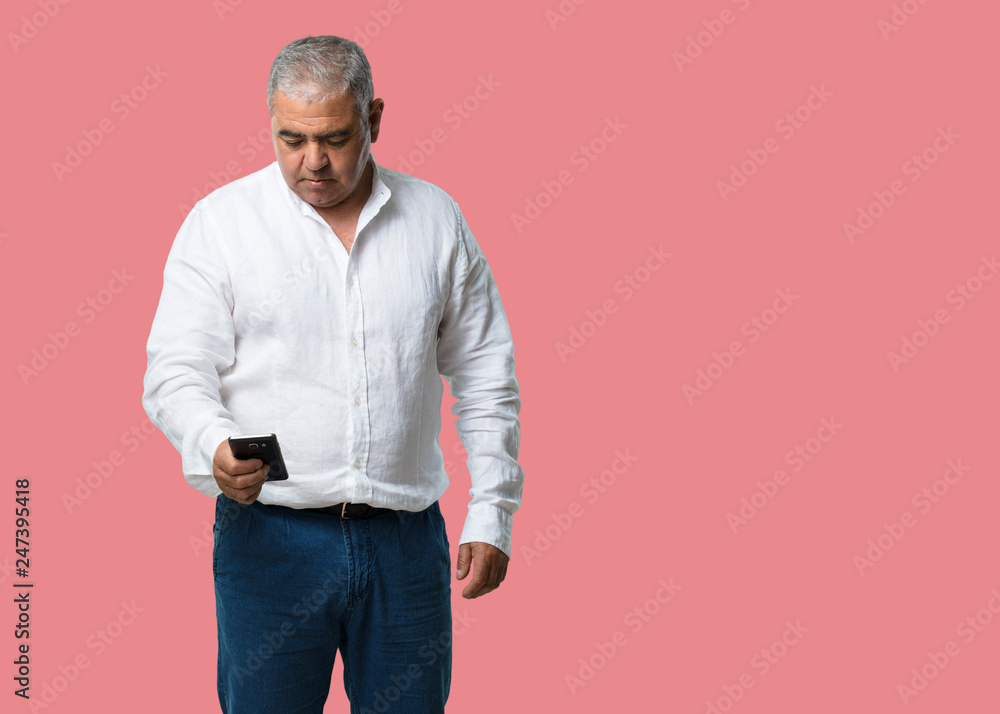 Middle aged man closeup of hand touching a mobile, using internet and social networks, positive feeling of future and modernity Middle aged man closeup of hand touching a mobile, using internet and social networks, positive feeling of future and modernity