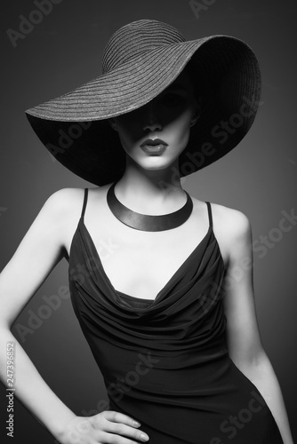 portrait of young lady with black hat and evening dress