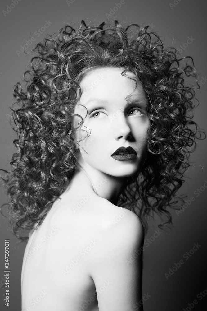 Beautiful nude woman with curly-hair and black lips. Beautiful nude woman with curly-hair and black lips.