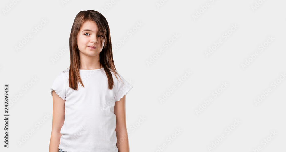 Full body little girl doubting and confused, thinking of an idea or worried about something Full body little girl doubting and confused, thinking of an idea or worried about something