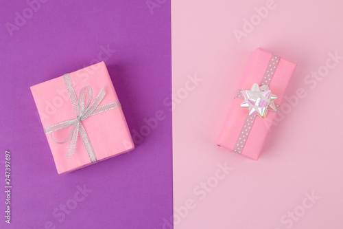 Gift boxes. Gifts on a bright lilac and pink background. Holidays. Valentine's Day. women's Day. mother's day. view from above. © MK studio