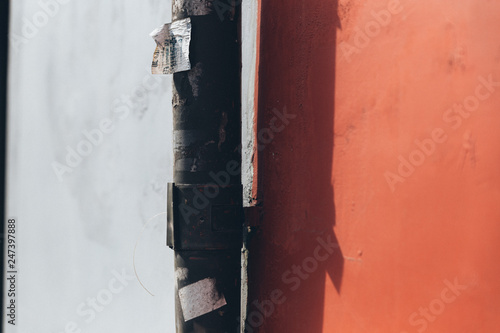 street pipe at the background of two-colored wall