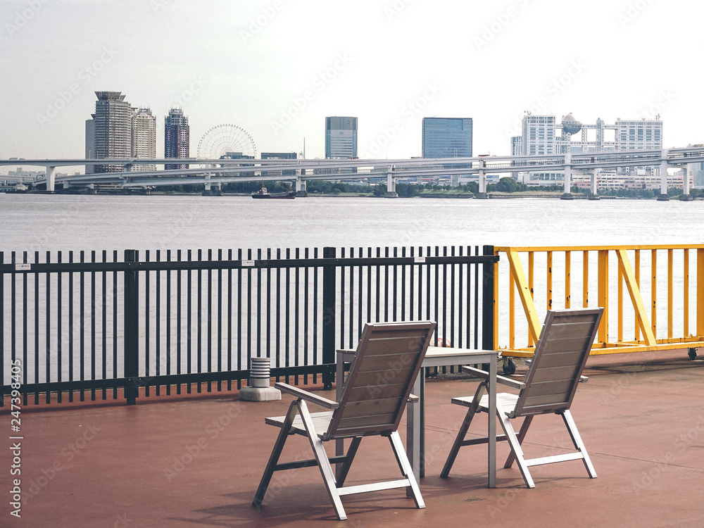 chairs and Sumida River and Odaiba view