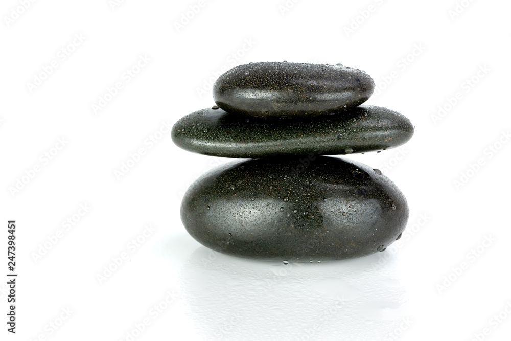 Stack of black pebbles on white background Stack of black pebbles on white background